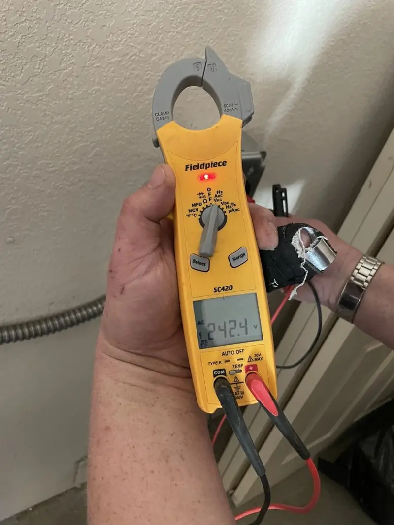 Voltage testing with clamp meter during Outlet Installation in Lake Forest Park